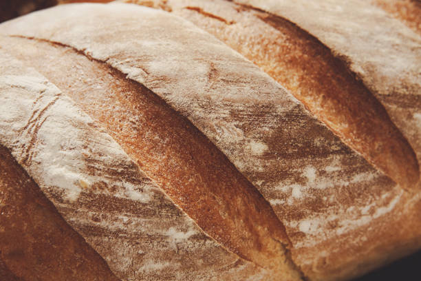 istock Bread texture background, closeup of baguette loaf 827955464
