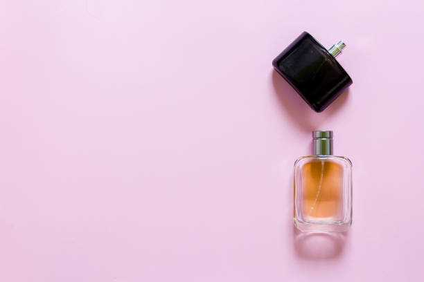 istock Two fragrance bottles on a pink pastel background 827967530