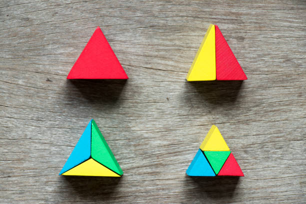 istock Mulit color toy block compound as triangle shape on wood background 827970622