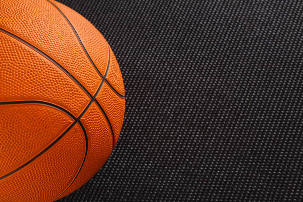 istock Basketball ball on black background copy space 827970912