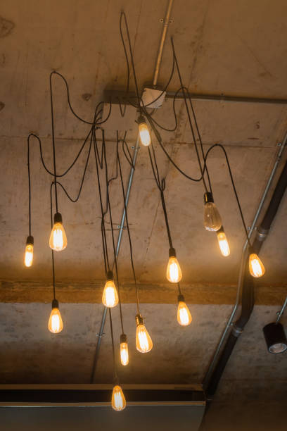 istock Antique light bulbs hanging on the ceiling 827971788