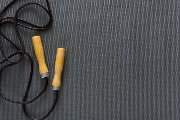 Top view of jump rope on black background