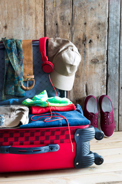 istock Holiday suitcase and summer accessories. Travel concept 827983334
