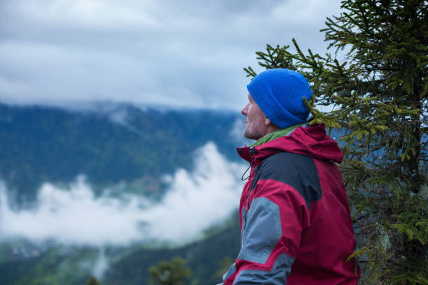 istock Meditating traveler watching the movement of heavy clouds 827986404