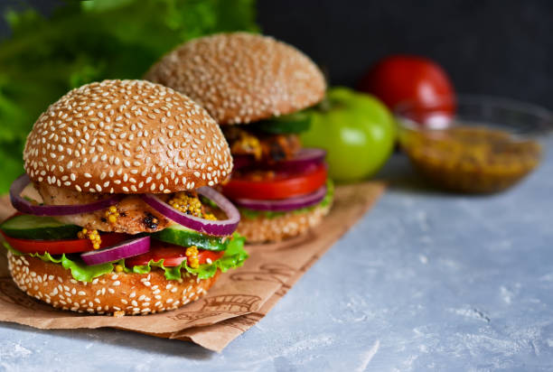 istock Homemade, big hamburger with meat and fresh vegetables with space for text. 827987896