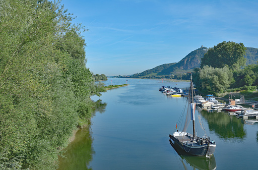 View from Grafenwerth Island at Rhine River in Bad Honnef to famous Ruin on Drachenfels Mountain,North Rhine Westphalia,Germany