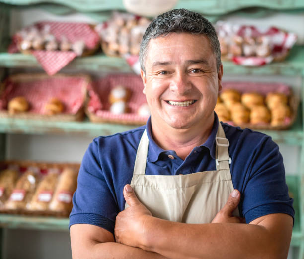 istock Happy business owner at a bakery shop 827992074