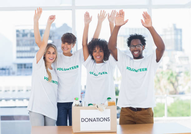 istock Volunteers raising their arms 828000344