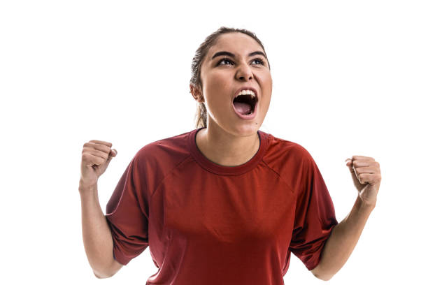 istock Girl wearing red uniform celebrates on white background 828001390
