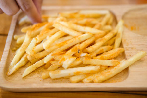 istock French fries on rustic wood, Fast food concept 828005210