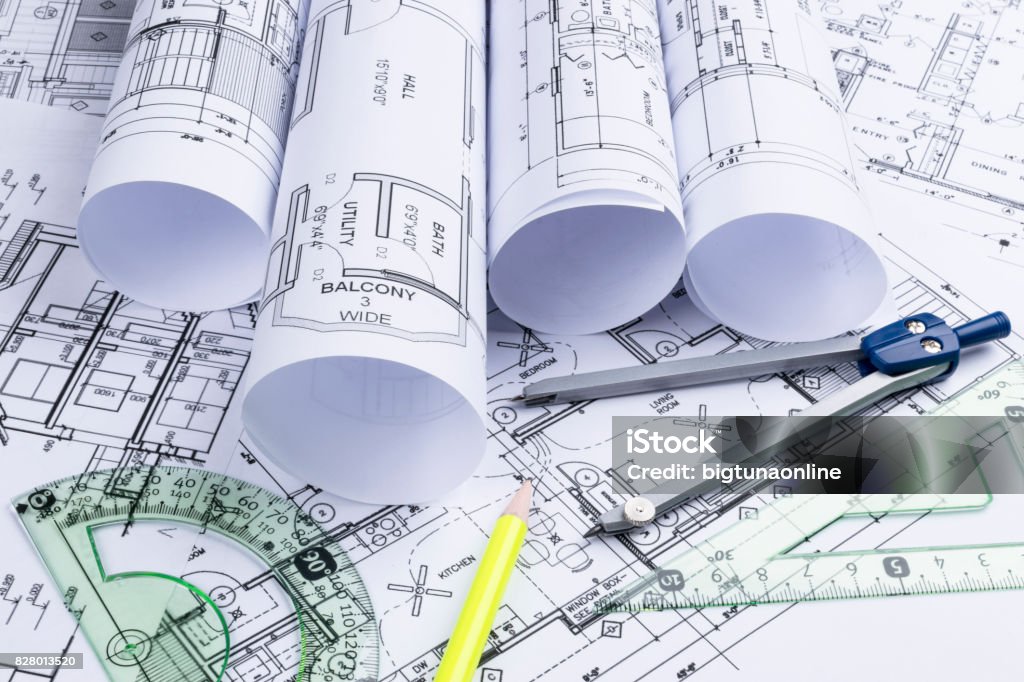 Architectural Blueprints And Blueprint Rolls And A Drawing Instruments ...