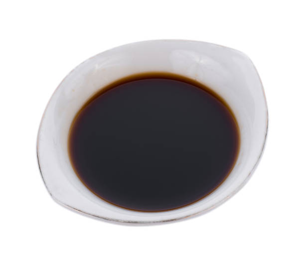 istock Bowl with soy sauce isolated on white background 828016386