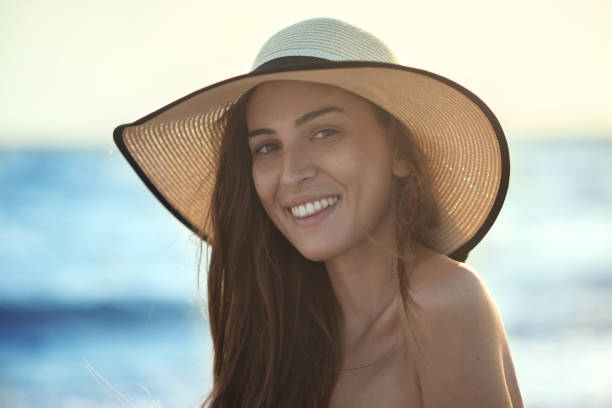 istock Young smiling girl at the beach 828018150
