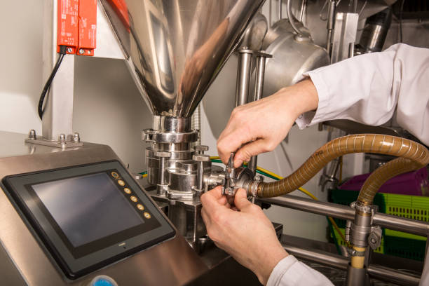 istock Woman hands the controls of a modern machine 828024848