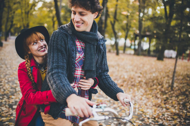 istock Loving couple driving a bicycle 828029616