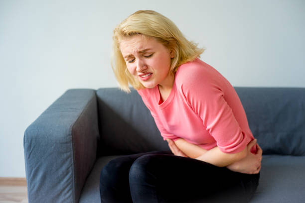 istock Girl suffering from a stomachache 828030034