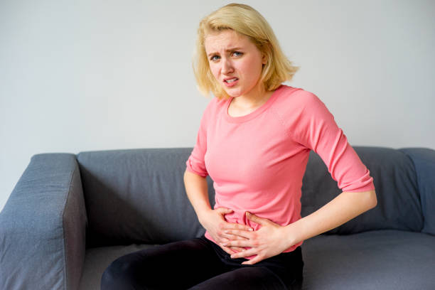 istock Girl suffering from a stomachache 828030246