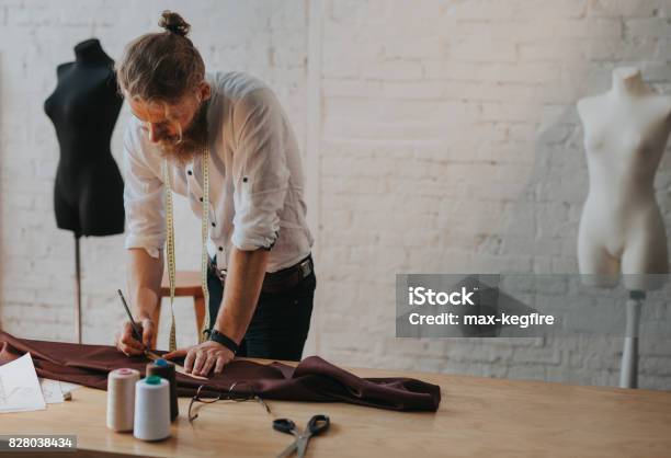 Bearded Man Leaning Upon Worktable Stock Photo - Download Image Now - Fashion, Clothing, Design Professional