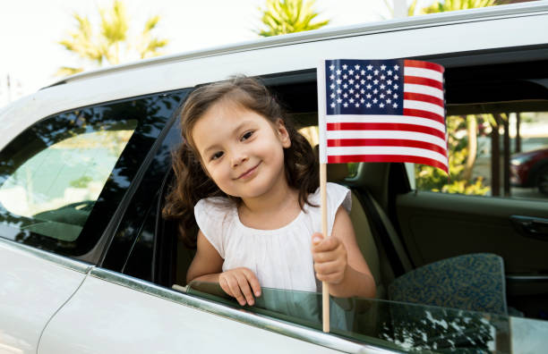 istock Girl Holding American Flag 828048412