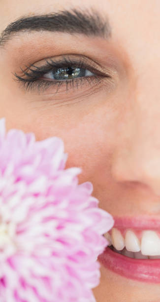 istock Natural woman holding a flower 828058502