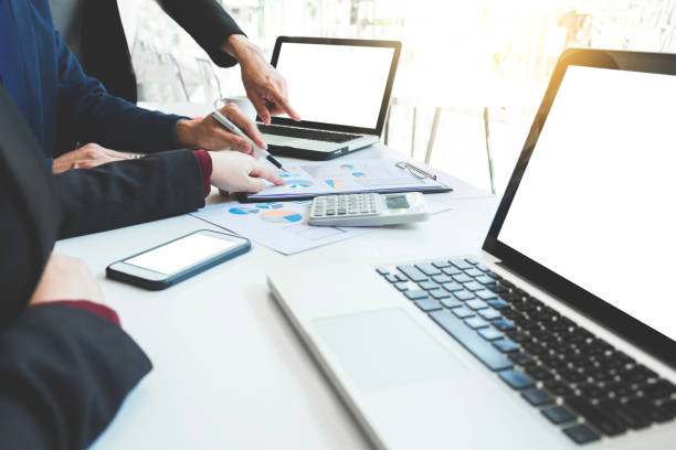 istock Business team meeting working with new startup project, discussion and analysis data the charts and graphs. Digital tablet calculator, laptop computer using, Business finances and accounting concept 828073638