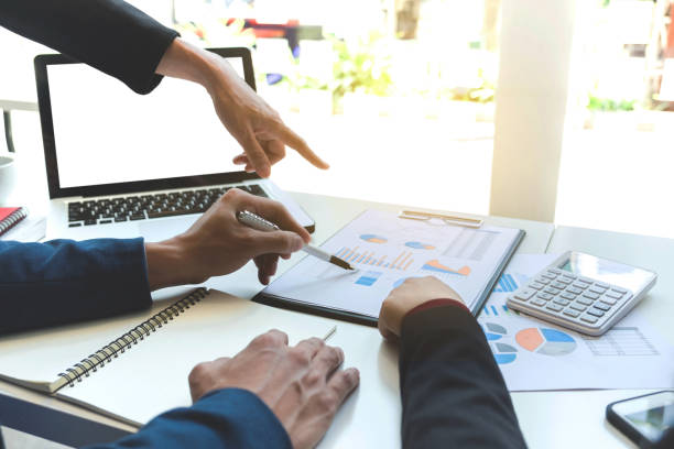 istock Business team meeting working with new startup project, discussion and analysis data the charts and graphs. Digital tablet calculator, laptop computer using, Business finances and accounting concept 828073658