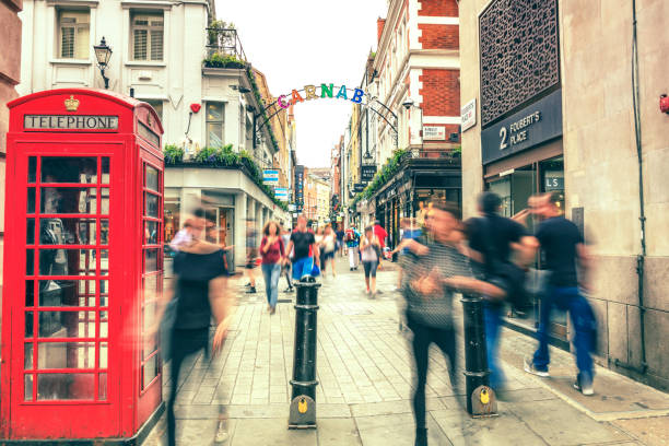 istock Blured people walking in Carnaby in London 828079922