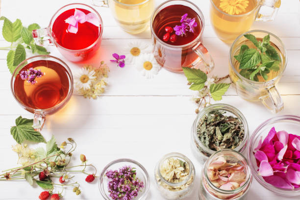 istock herbal tea in cups on a white background 828082704