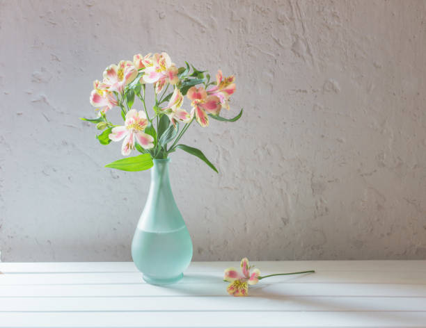 istock Alstroemeria in vase on grunge white background 828082718