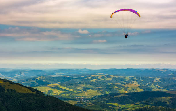 istock Skydiving  extreme over the rural valley 828083740