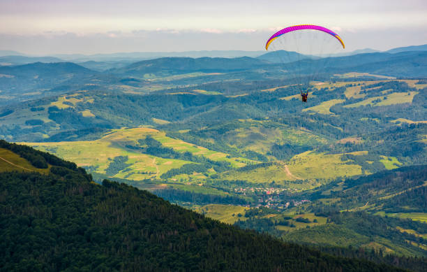 istock Skydiving  extreme over the village in valley 828083850