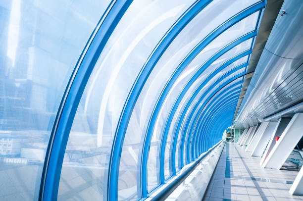 istock Empty glass corridor in business center 828087862