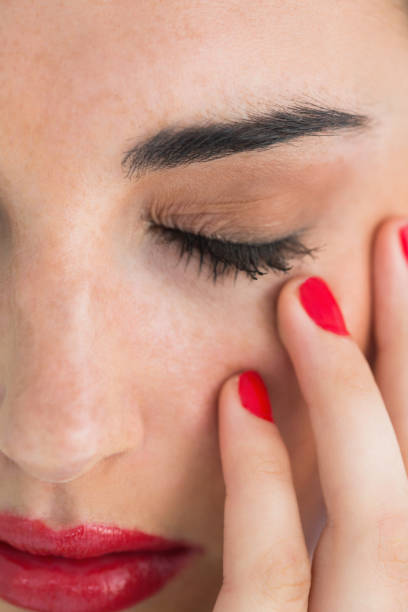 istock Woman with red lips touching her skin 828105896