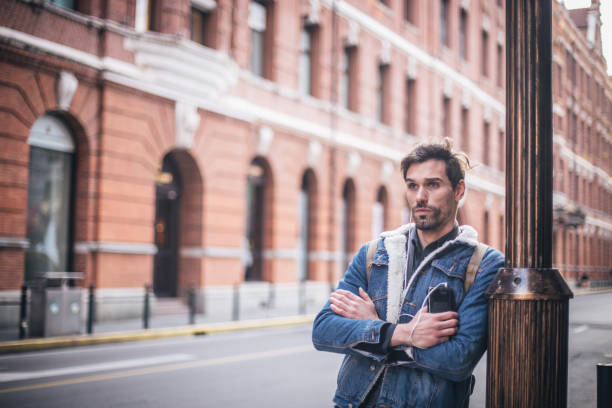 istock Cute man listening music 828106200
