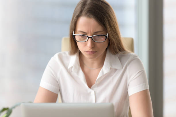 istock Anxious confused businesswoman having problem with pc laptop, headshot portrait 828110524