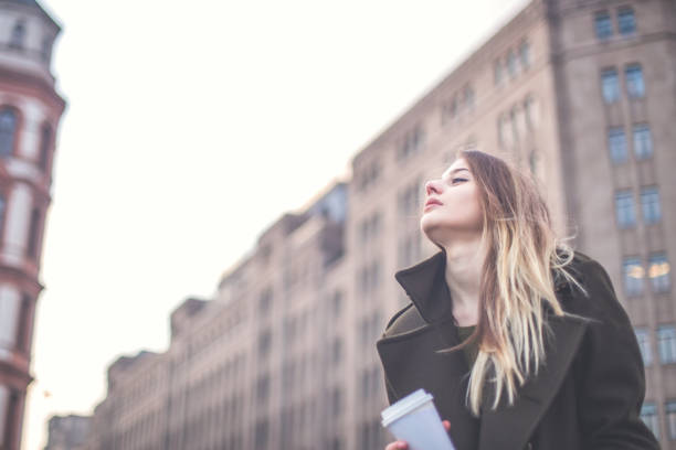 istock Blond girl on coffee break downtown 828117072