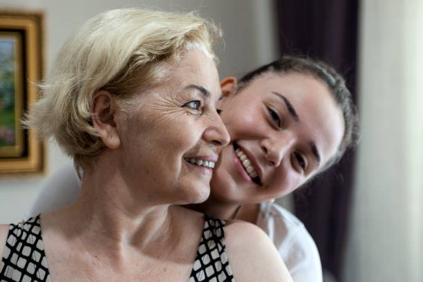 istock Smiling young daughter hugging her mother 828117152