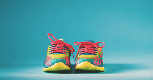 istock Colorful running sneakers on a blue background 828122274