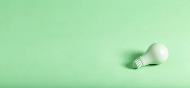 istock Green energy theme with green light bulb 828122382
