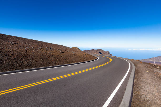 highway above the clouds, maui island, hawaii islands - haleakala national park mountain winding road road imagens e fotografias de stock