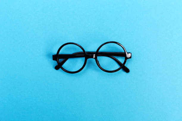 istock Round glasses on a bright blue background 828131334