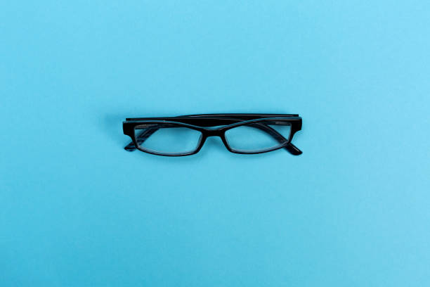 istock A pair of glasses on a blue background 828131492