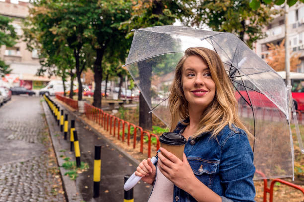 istock Pregnant Woman enjoying rain 828136220