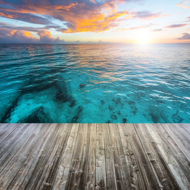 Wooden deck at Caribbean sea at sunset