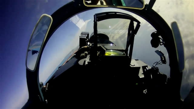 The flight of a military aircraft. View from the cockpit.