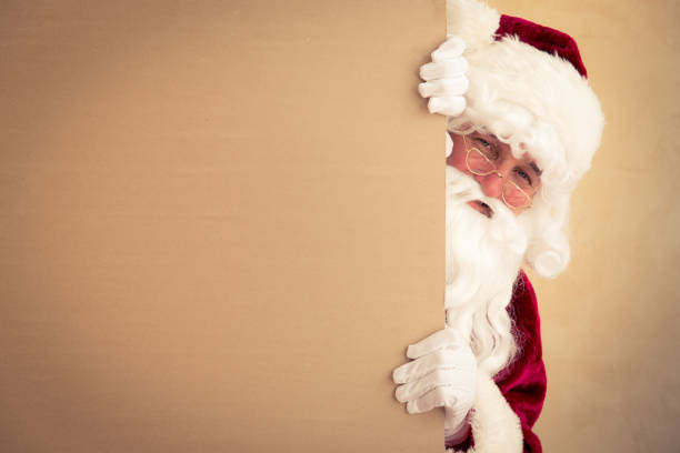 istock Santa Claus holding banner 828144890