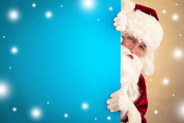 istock Santa Claus holding banner 828144898