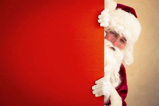 istock Santa Claus holding banner 828144988