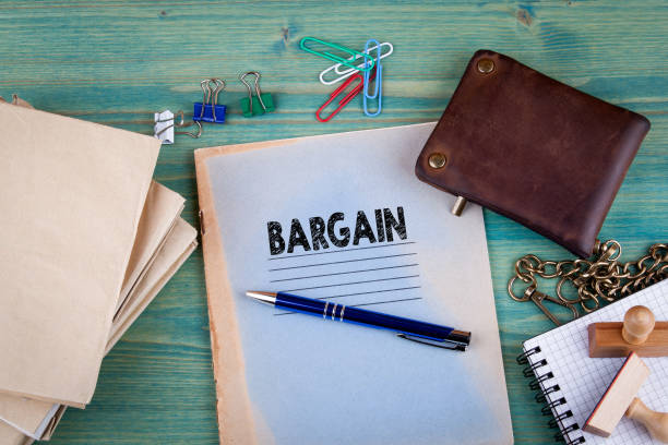 istock Bargain concept. Notebook on a bright green background. Office stationery accessories 828145278