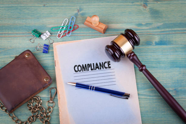istock Compliance concept. Notebook on a bright green background. Office stationery accessories 828145770